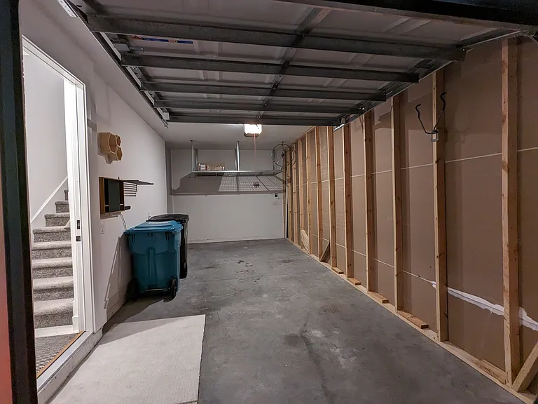 Your Own Garage with inside Access! Storage under the stairs and on Two Overhead Racks. Oversized - fits crew-cab trucks!