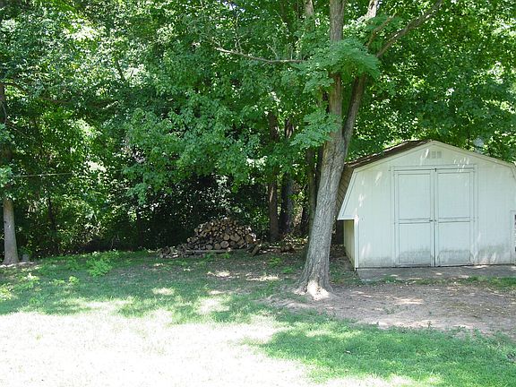 property backs up to wooded area, back yard shed