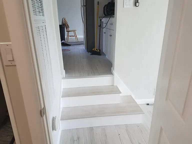 Steps down to den or family room
