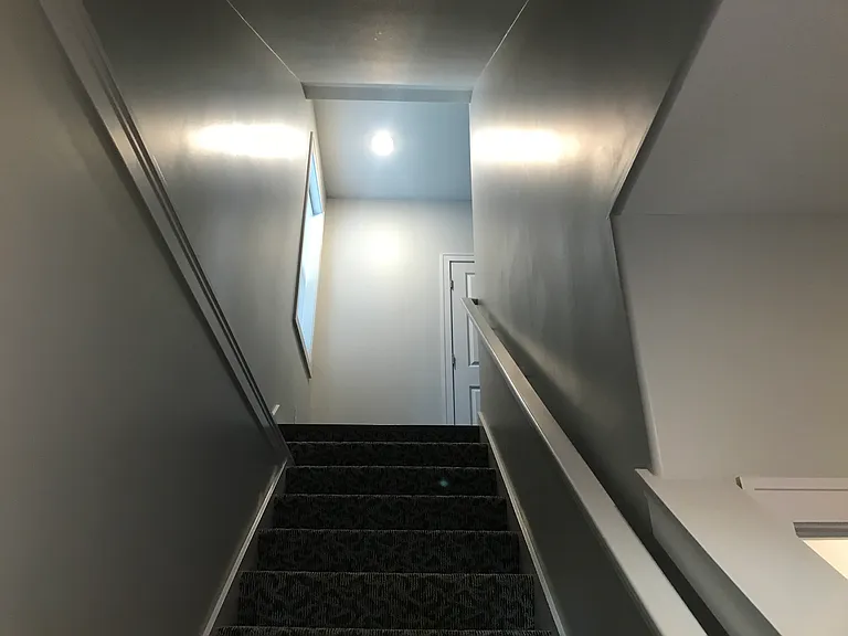 Entrance going upstairs to main level