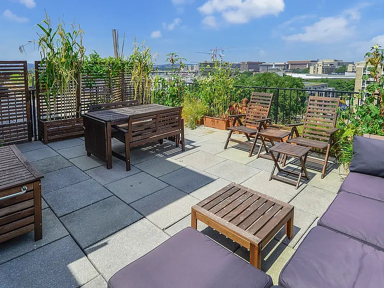 ...Large private patio that opens to rarely used larger public area.