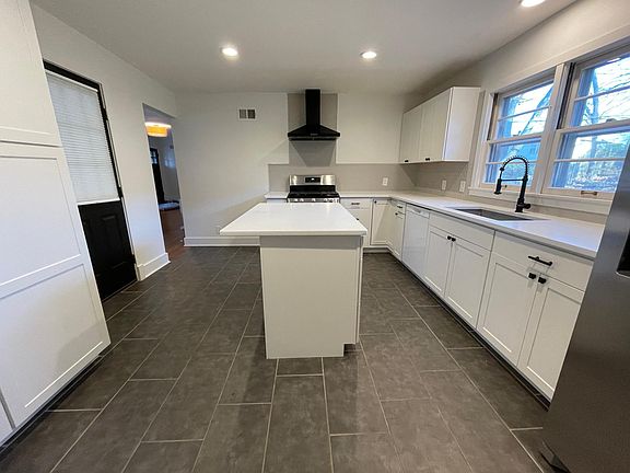 Kitchen (Includes gas stove, refrigerator, dish washer and laundry washer and dryer)