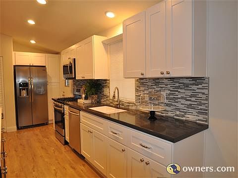 Elegant quartz counter tops, new cabinets, and appliances