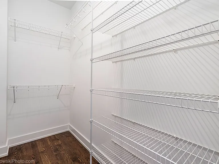 Walk-in closet in primary bedroom