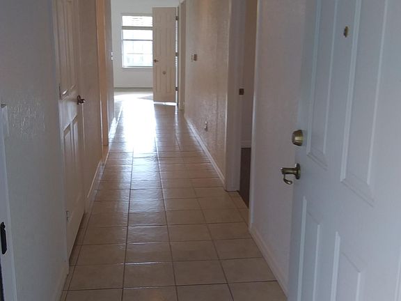 Tiled hallway - front door to living area