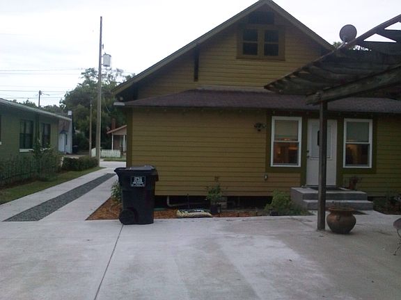 Paved driving to backyard makes for easy parking