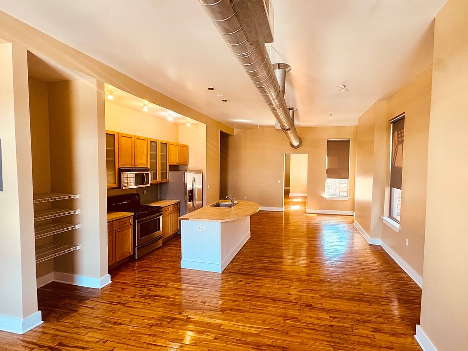 Open living space, kitchen, and dining.