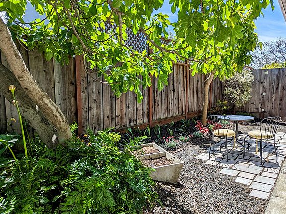 Lush private yard with bistro table