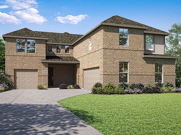 A two-story brick house with a tiled roof, surrounded by a well-manicured lawn and lush greenery, st