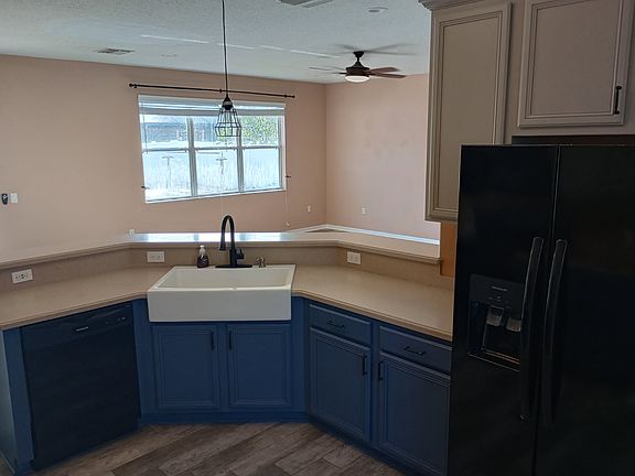 Kitchen viewing out to the living area and back yard