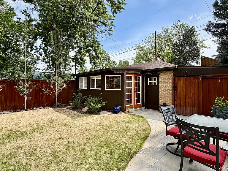 Detached office space ideal for remote work and a single car garage providing ample storage space