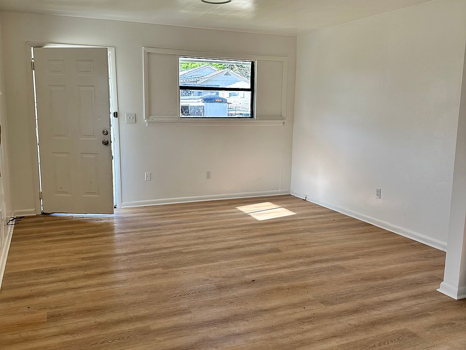 Large spacious living room with new floors and new paint through your entire home