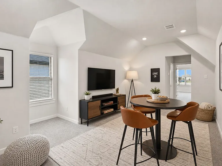 Virtually staged photo of the bonus room upstairs which would make an amazing game room, bedroom or office!