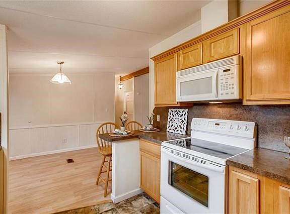 Check list for an fun  place to prepare those meals:  new cabinetry, free standing range , built in microwave ..w ventilation out, new counter tops.