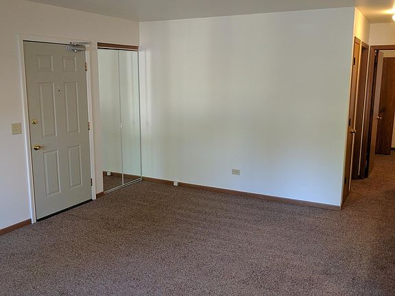 Living room with mirrored closet door