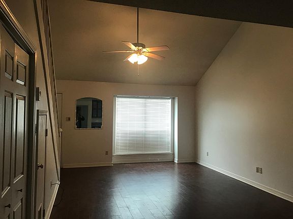 View of living room standing in the kitchen facing the front door
