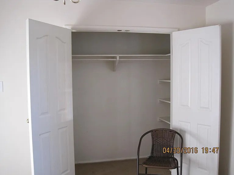 A foot & a half more space inside each bedroom closet at each side of the open doors. Storage space on shelf above closet rail extends to the ceiling.