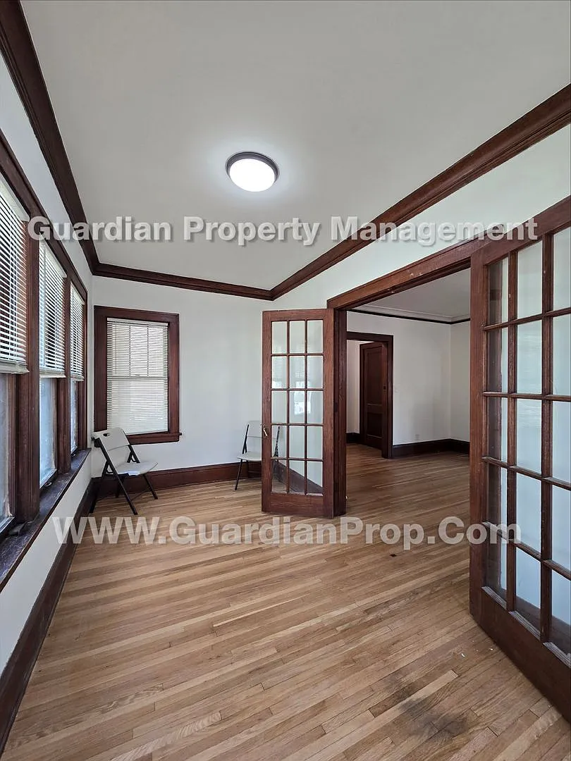 Large main floor duplex unit, Updated Kitchen & Bath, Full Dining Room w/Built-ins + Sunroom, gar... — Photo 4
