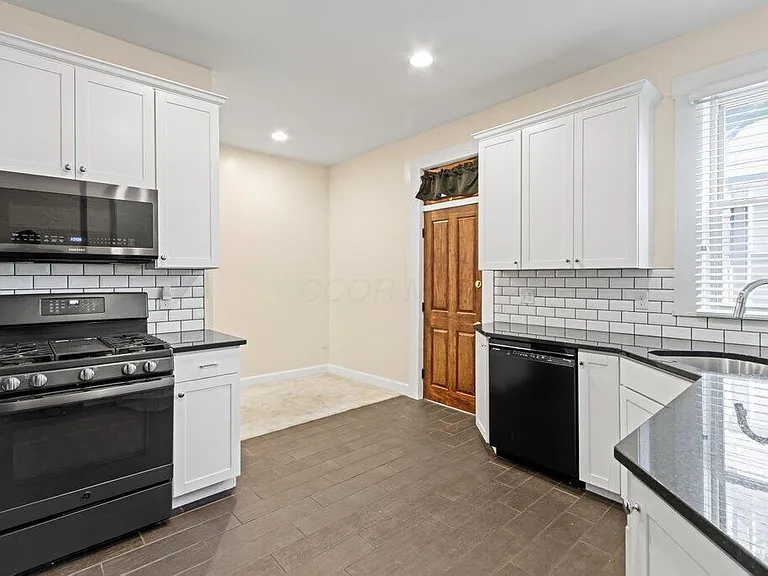 Gas oven with microwave