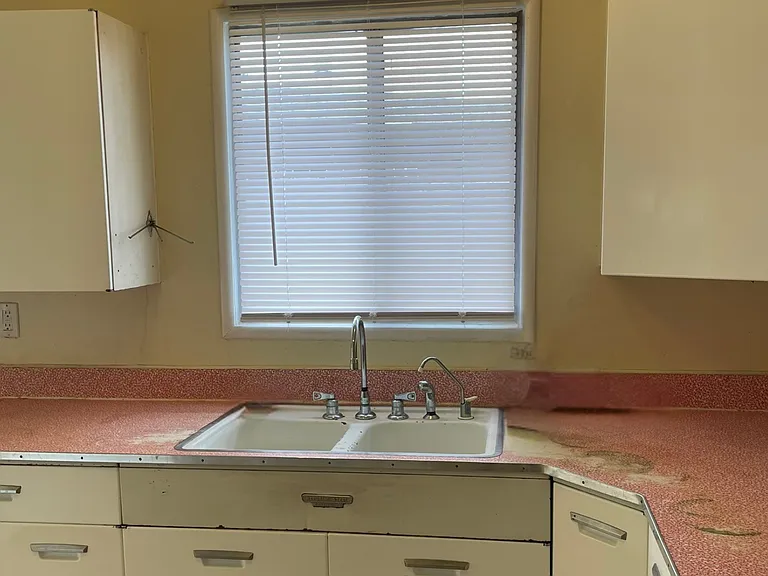 Bright Kitchen with Lots of Retro Cabinet Space and Large Gas Range and Oven