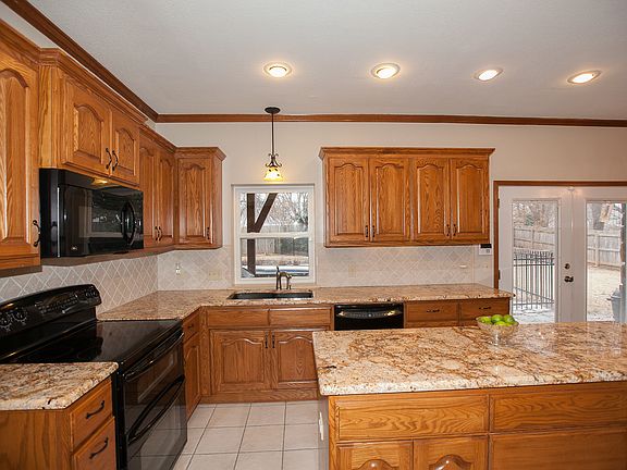 Great work space in kitchen and breakfast nook, natural light, over looks pool and back yard
