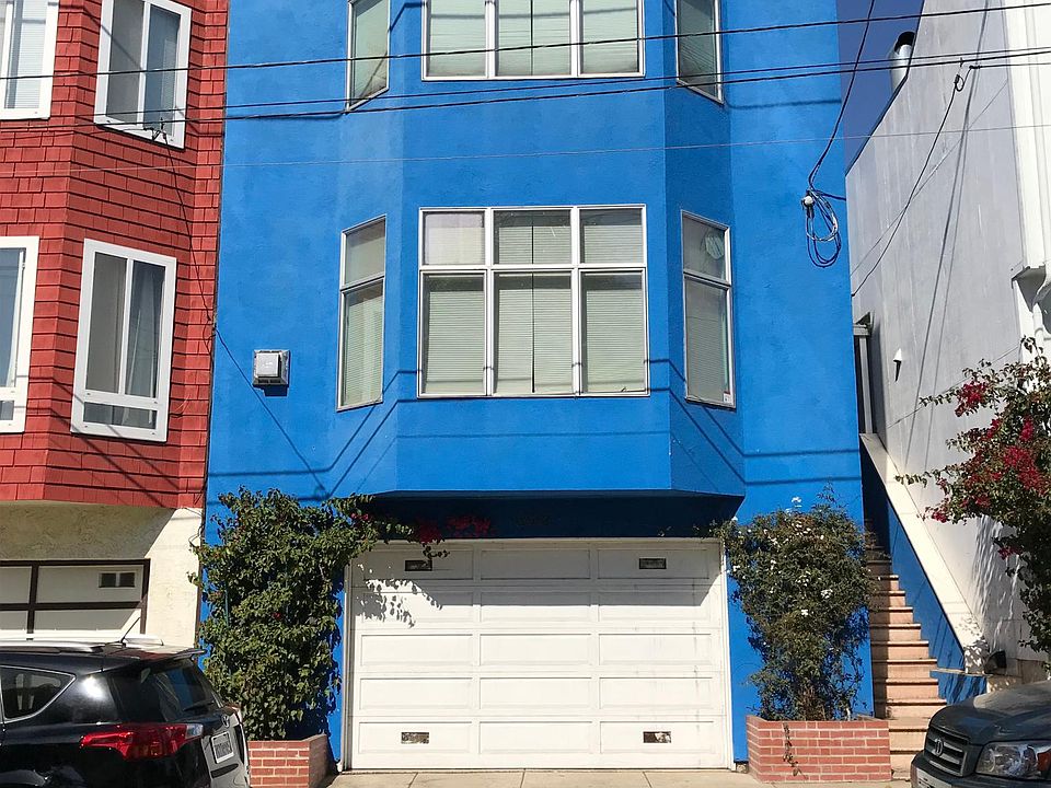 Front of the house. Lowest level is 2 car garage w/ laundry, bedroom & full bath; middle level is living room, kitchen, dining room, office, half bath & slider to back yard; top level has master suite, 2 bedrooms & 1 full bath.