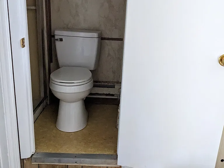 Third floor, office/playroom with a convenient half bathroom