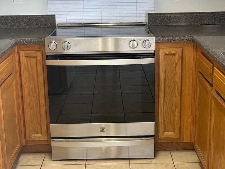 Modern electric stove/oven for your daily use, and an above range Microwave to handle any needs.
