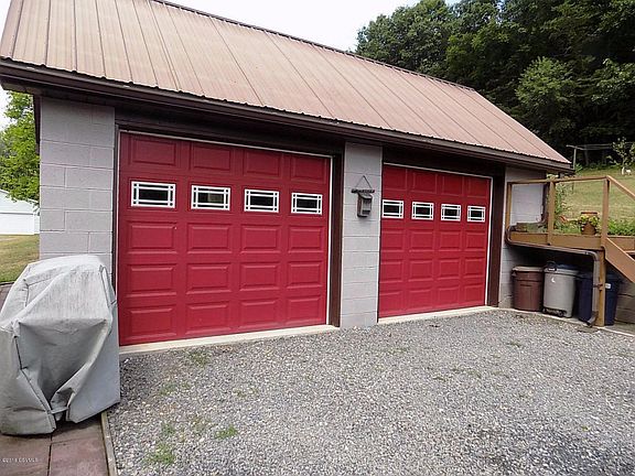 2 Bay Garage Great for Lawn Equipment.
