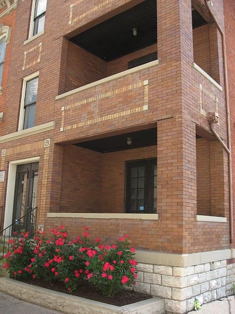 Early 1900's classic "3 flat" Building. Covered brick porche