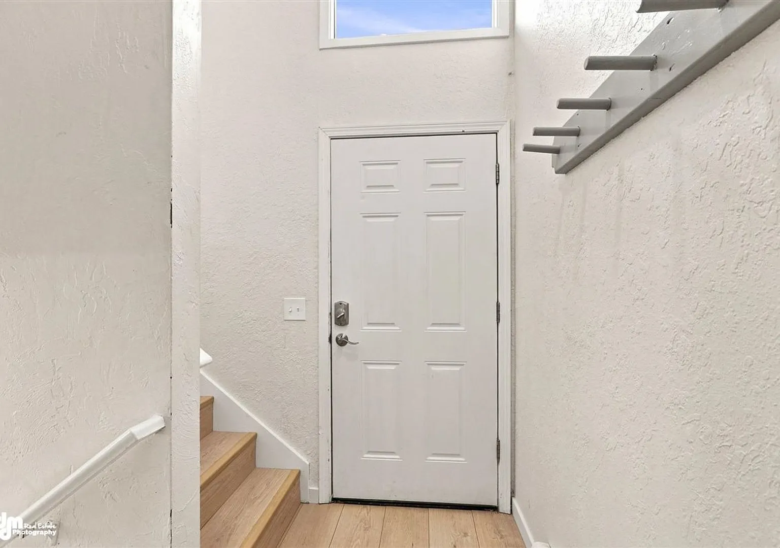 The Single-Family Alternative: 4BD/2BA Triplex Unit with Modern Comforts — Photo 1