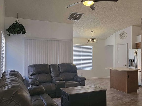 Open great room with vaulted ceilings.