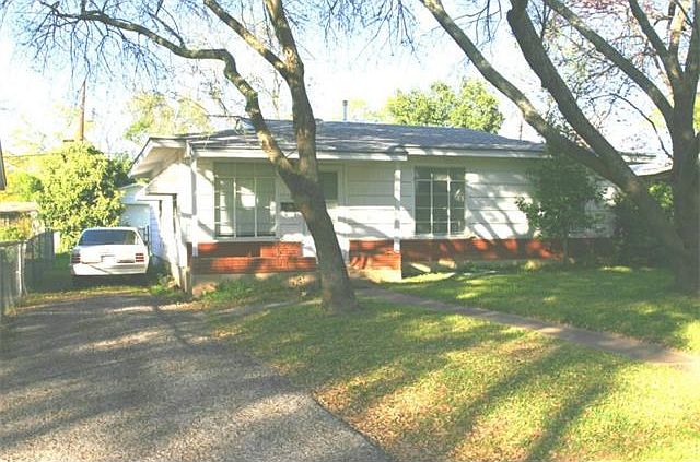 1950's Crestview with original charm and character. Outside this small home has asbestos siding, a rock planter near the front door, jalousie crank out windows that don't open and a narrow driveway leads to the garage at the back of the lot. Wood floors u