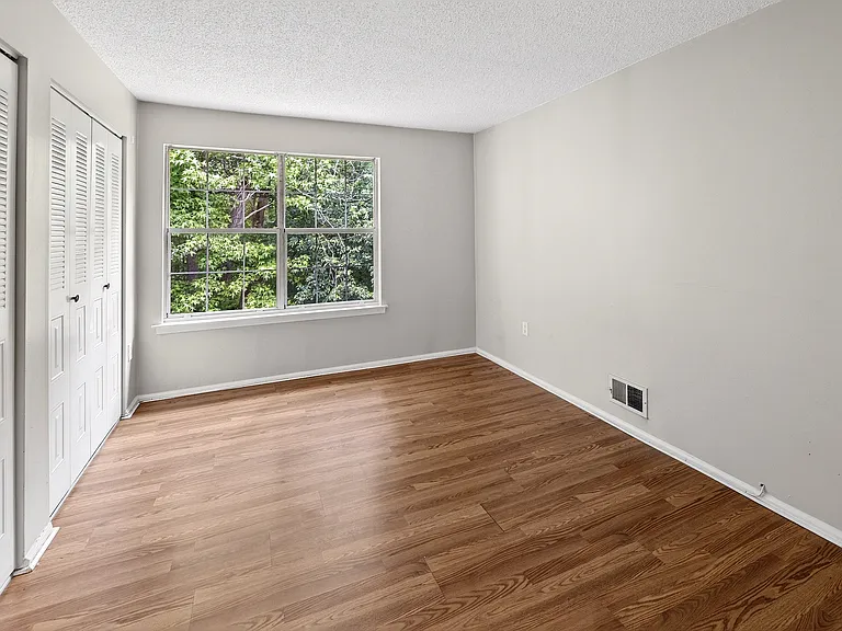 Large second bedroom with 2 sets of double closets