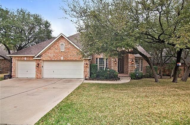 Beatiful curb appeal with mature landscaping and lovely shade trees.