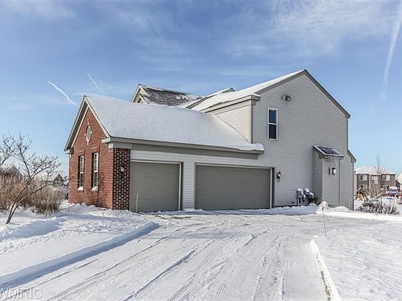 . . . HUGE 19 x 31 FINISHED, HEATED GARAGE; EACH DOOR W/DOOR OPENER & MAIN HAS KEYPAD ENTRY. ONE OF 