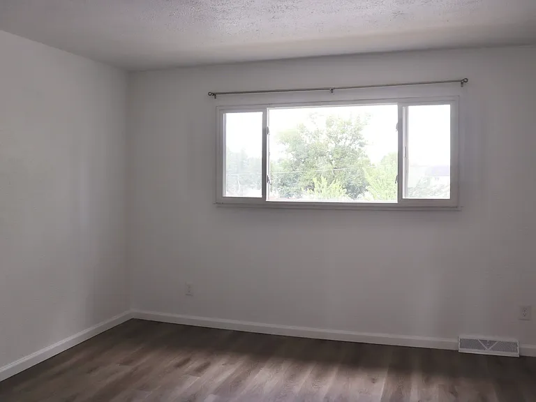 Upstairs primary bedroom, north facing window.