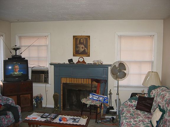 Living room with woodburning fireplace