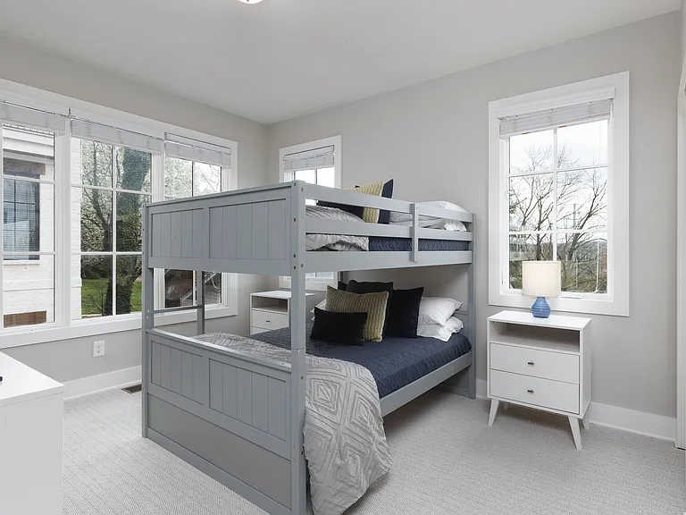 Bedroom 3 with a bunk bed, ensuite bathroom, Smart TV and dresser for your belongings. Also includes a walk-in closet. Located on the 2nd floor.