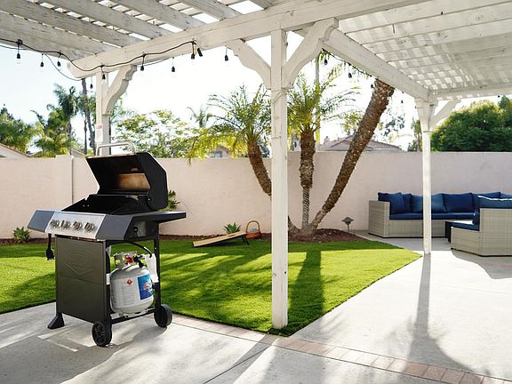 Propane grill, corn hole, patio seating