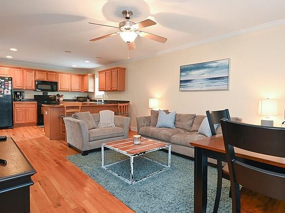 Living area, with breakfast bar and kitchen table