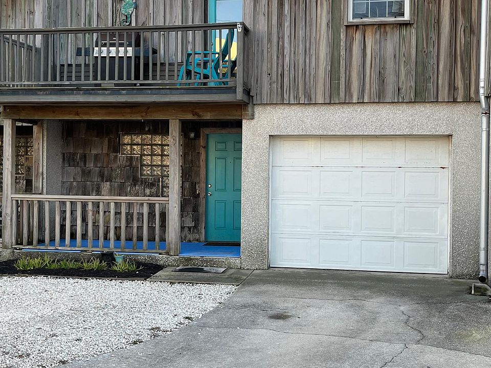 Attached one car garage with additional 2 spots out front.