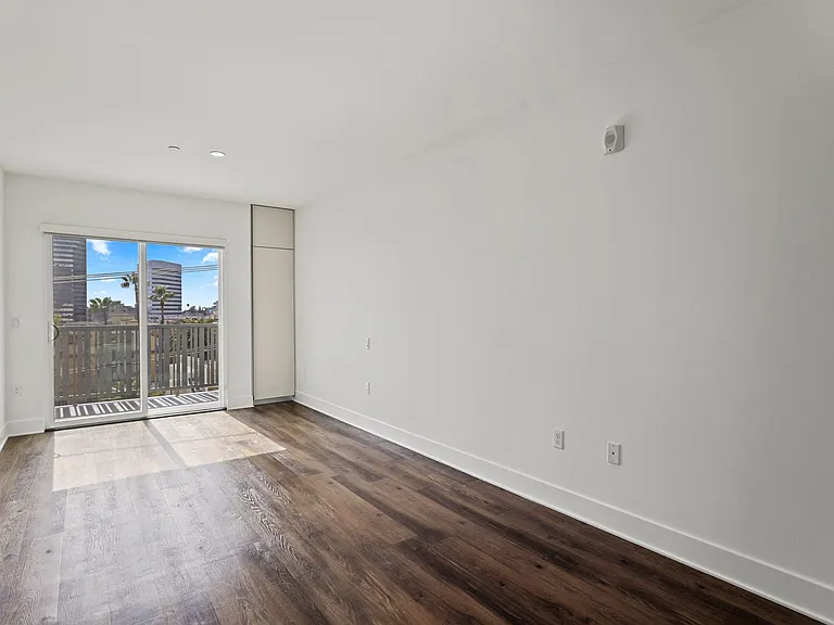 Living Room with Patio and Built-In Cabinet Storage
