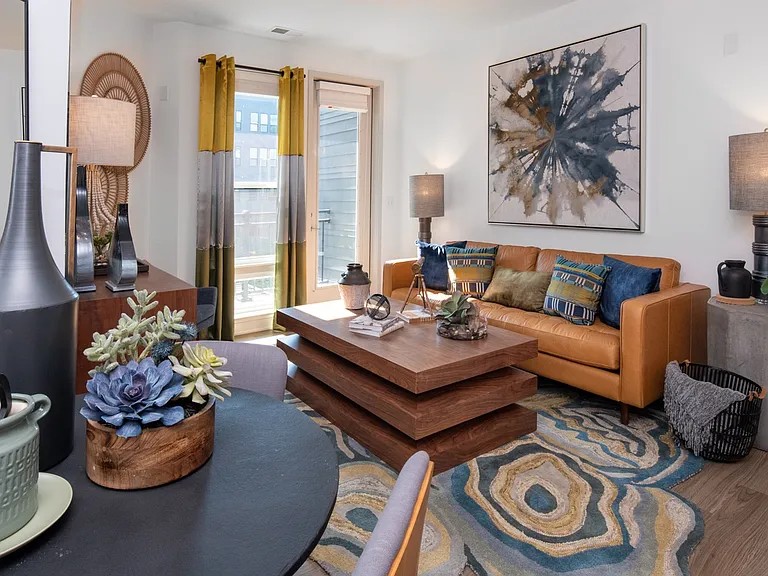 Bright living area with bold style and private balcony access.