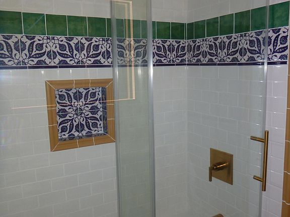 full bath with turkish tile and brass fixtures