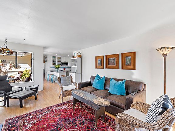 Living room opens to kitchen