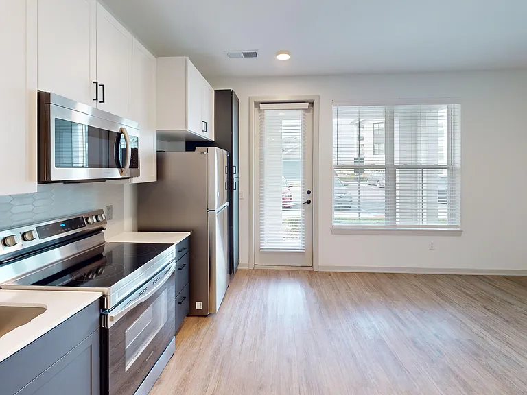 The Eleanor floor plan offers a spacious kitchen and living area with access to a private patio or balcony. The Eleanor floor plan offers a spacious kitchen and living area with access to a private patio or balcony.
