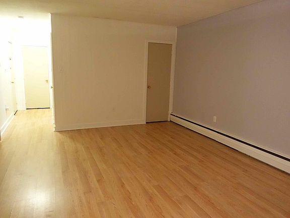 Living room/Dining room, facing closet and hallway (with two additional closets).