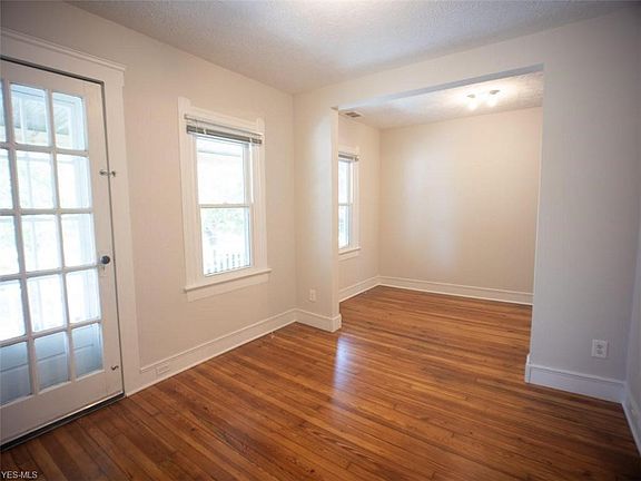 Living room and door to upstairs porch