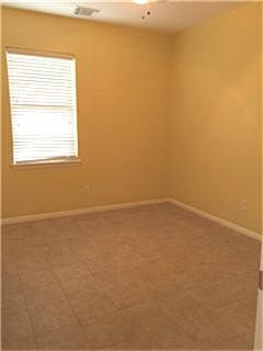 Master bedroom downstairs w/tile floors
